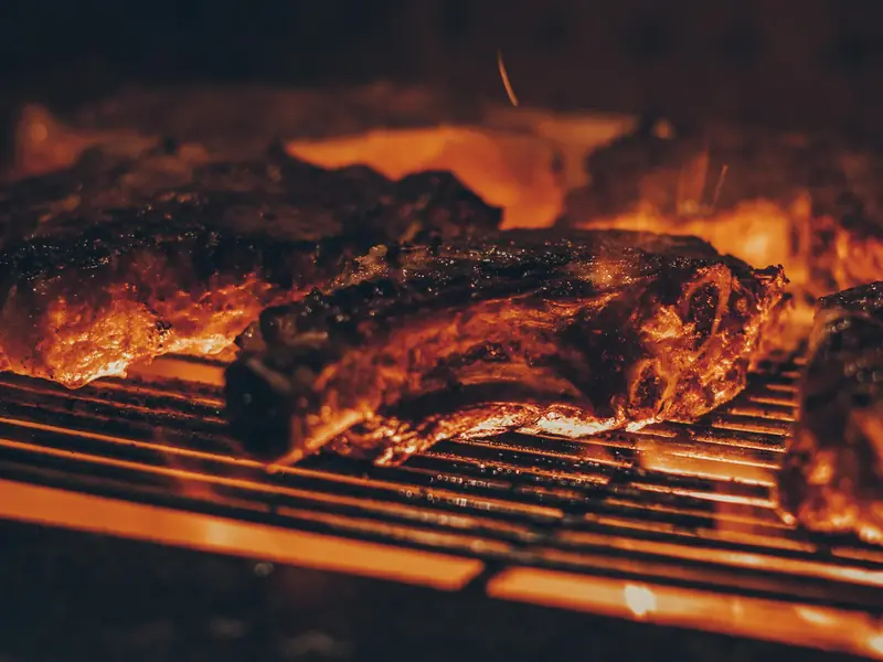 Short ribs searing over open flames