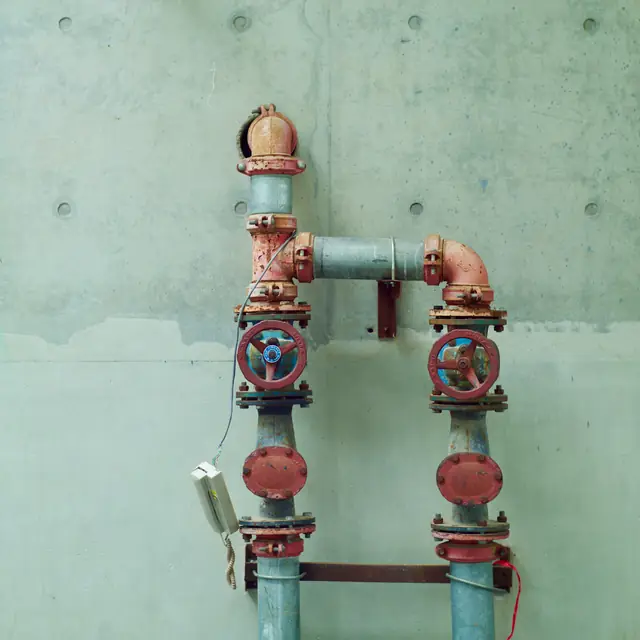After: a dry pipe manifold with two red valves